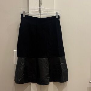 Women’s knee length midi and leather skirt. No tags, worn twice